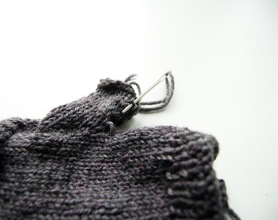 Knit thumb and sew thumb seam.