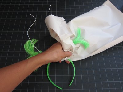 Wrap horns with newspaper.