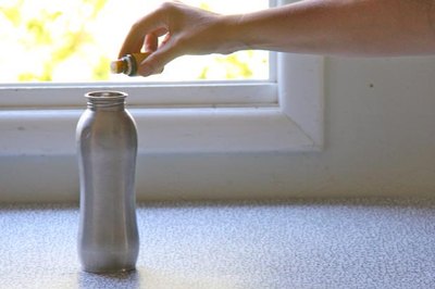 Drop lemon oil in a water bottle to clean it.