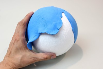 Attach the clay to the sphere