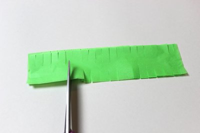 Cut slits along the edges of the narrow strips