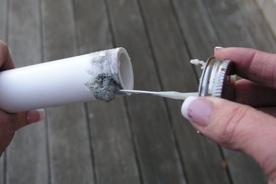 Apply the glue around the tube.