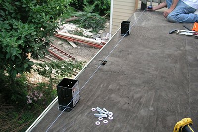 A chalk line keeps the alignment straight.