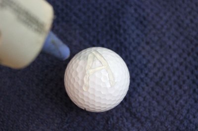 Write an initial with a hot glue gun