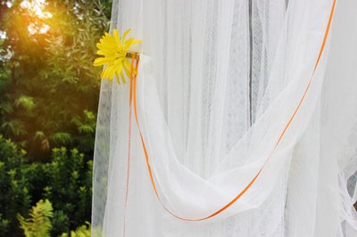 Clip a tieback to the sheer panels