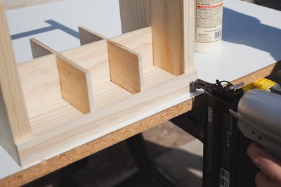 Attaching the wood slats on the outside.