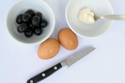 One egg makes two spiders, and you'll need two olives for each.