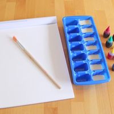 You'll need condensed milk, food coloring, a paint brush, and something to paint.