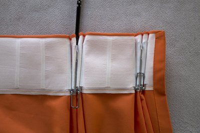 Attach pleat hooks.
