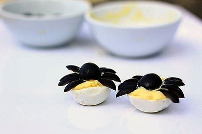To transport, use a deviled egg carrier or on a tray with rolled up paper towels in between rows of eggs.