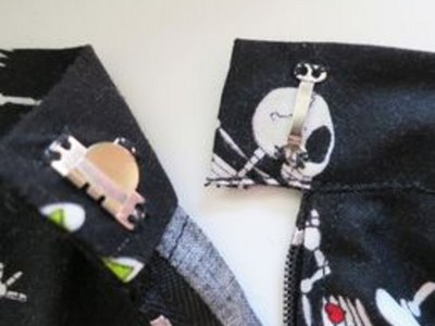Trouser hook on waistband.