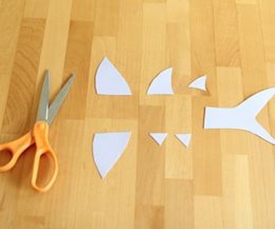 Cut the shark's fins and tail out of cardstock.