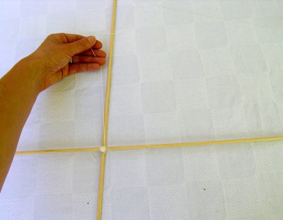 Run string around dowels to make the frame.