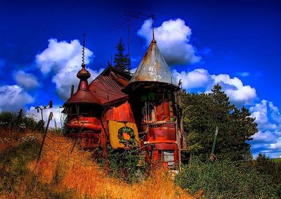 This castle-style house is made from junkyard scraps.