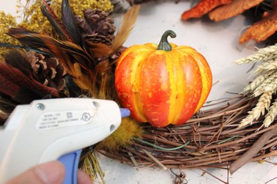 Hot glue gourds to the wreath