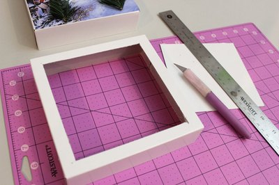 Cut an opening with a 1/2-inch border in the second lid.