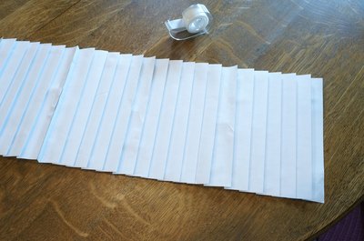 Tape sheets together.