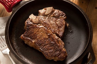 Grilled steak in a cast-iron skillet.