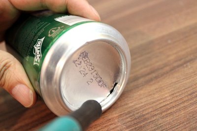 Cut out the bottom of the can