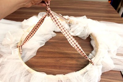 Tie ribbons around the hoop
