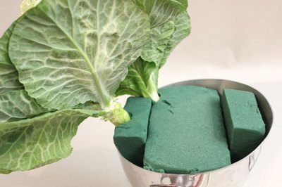 Insert the cabbages into the floral foam