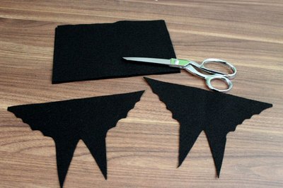Cut bat wings and legs out of felt