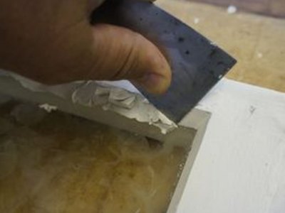 Pull a straight line with your putty knife.