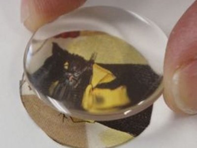Align carefully and avoid touching the adhesive.