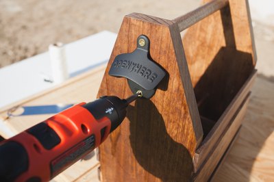 Attaching wall-mounted bottle opener.