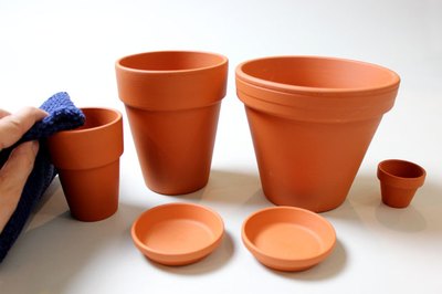 Wipe the clay pots with a damp cloth