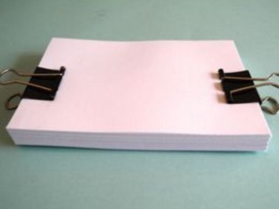 Use binder clips to secure pages.