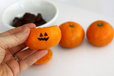 Dry off the empty orange peel before drawing on it.