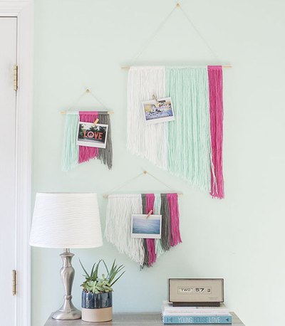 Make your own customizable wall art using yarn and wooden dowels.