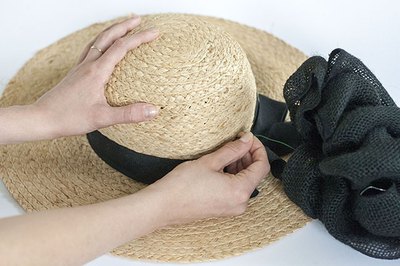 An oversized bow gives the hat volume
