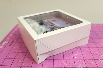 Slide the clear plastic box lid over the other.