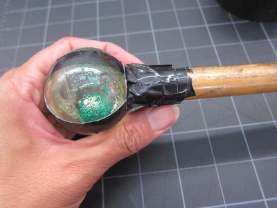 Attach bouncy ball to bamboo rod.