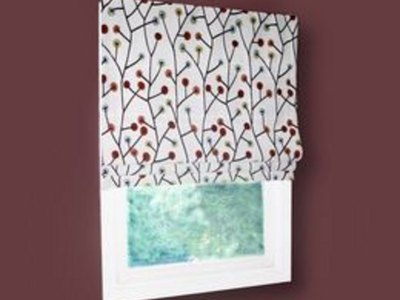 A roman shade adds an elegant touch to a room.