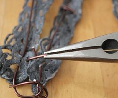 Pinching the wire.