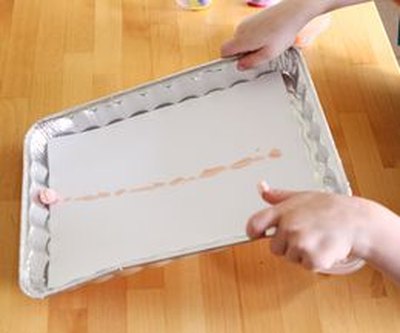 Tilt the pan to move the marble.