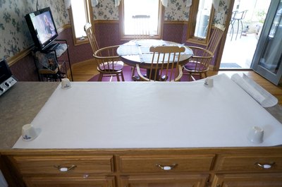 Spread out the film to ease the process of trimming the film to your window's exact size.