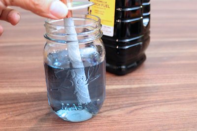 Fill the jar with torch fuel