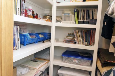Shelf storage built into closet.