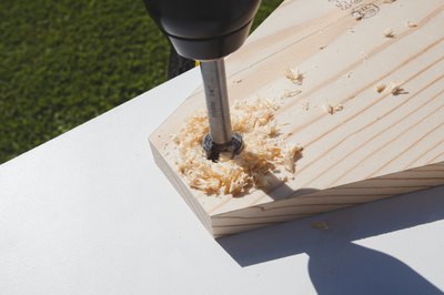 Drilling a ¾" hole for the handle.