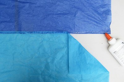 Glue sheets together.