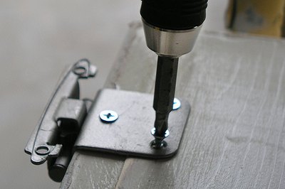 A portable screwdriver helps the process.