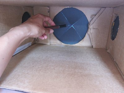 Cut away paper to reveal holes.