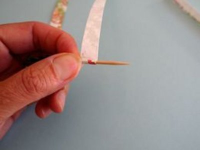 Tightly roll around toothpick.