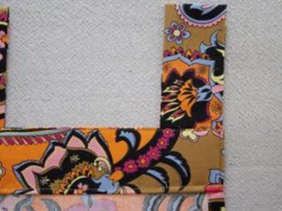 Topstitch facing.