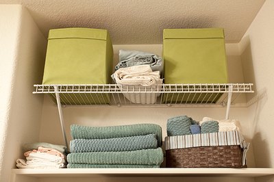 Fill shelves with items right up to the ceiling to maximize your closet storage.