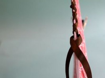 Weave ribbon down spine.
